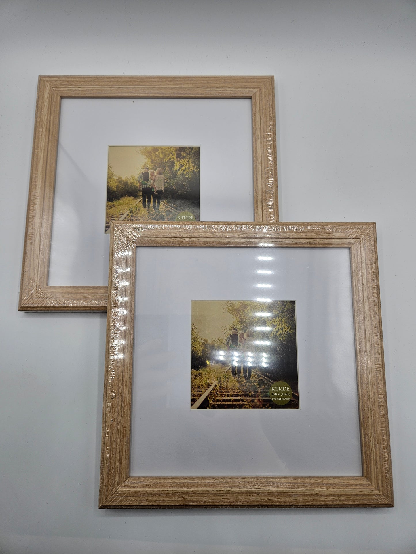 2 - Wood 8×8 inch picture frames.