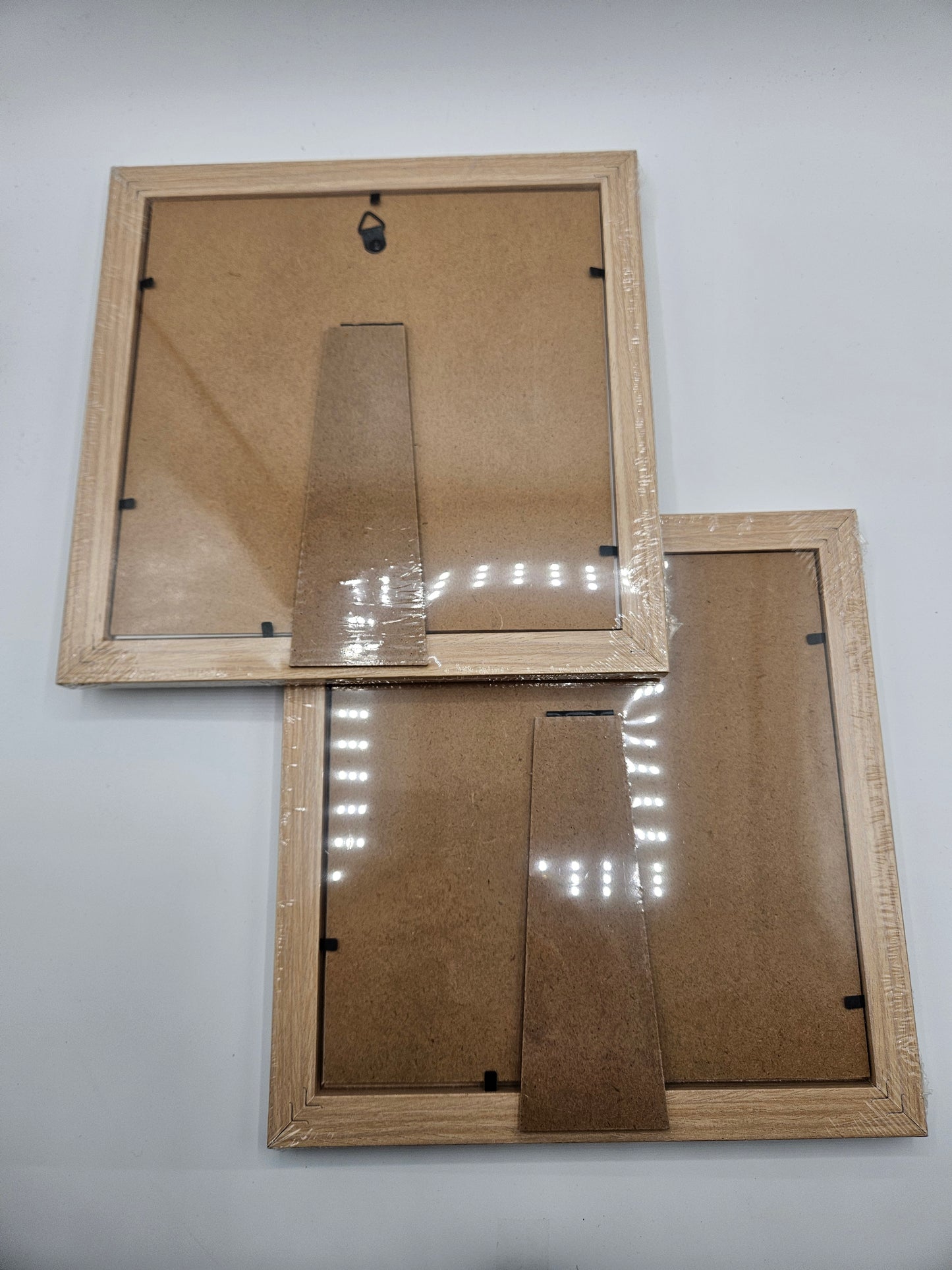 2 - Wood 8×8 inch picture frames.